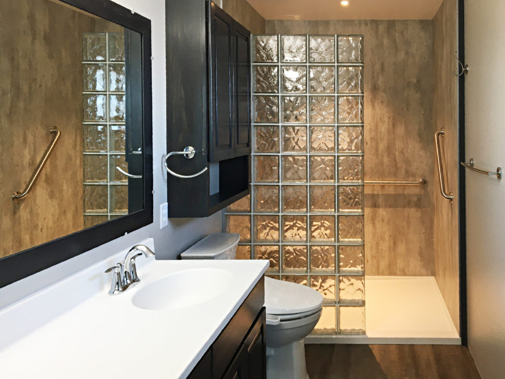 Gehling-Master-Bathroom-with-Glass-Block-and-Cracked-Cement-Wall-Panels