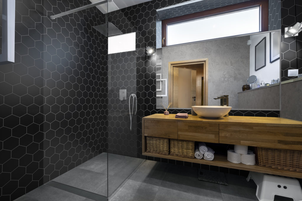 Modern interior design - bathroom in gray and wooden finishing